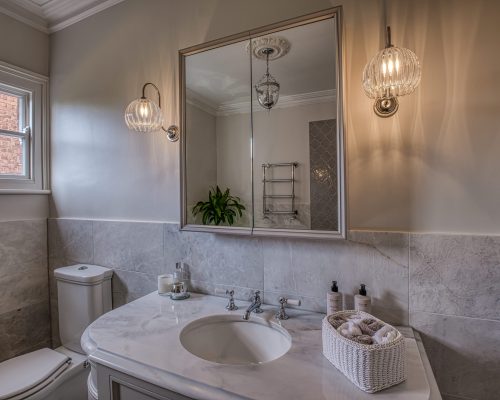 Elegant glass bathroom wall lights and custom mirror cabinet